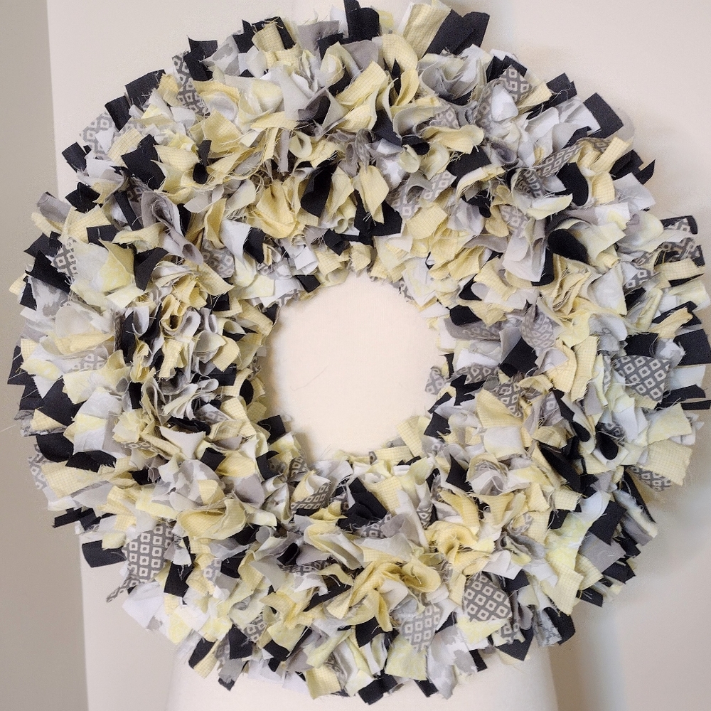 Hand crafted up-cycled rag wreath, shades of yellow and gray.